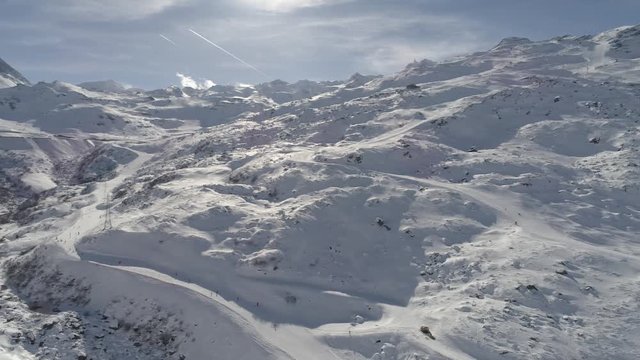aeria view of beautiful  winter nature landscape  mountains covered with fresh snow at beautiful sunny day fly over peaks
