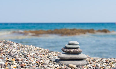 Fototapeta na wymiar stack of stones on a pebble beach