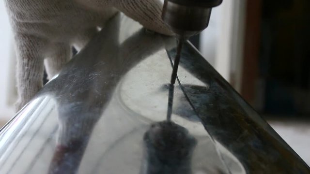 Close up shot hands of technician using rivet plier a sheet of alu zinc