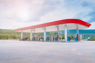 Gas fuel station with clouds in the sky and sun light