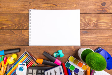 Desk cluttered with office supplies
