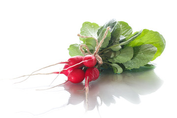 Ripe red radish with foliage