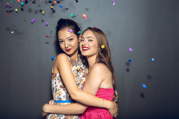 Obraz na płótnie Canvas Cheerful beautiful young women having party
