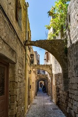 Fototapeta na wymiar Charming narrow street at Rhodes old town, Rhodes island, Greece