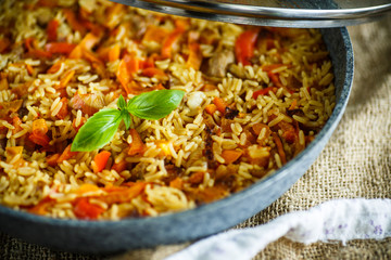 Pilaf with beef, carrots, onions, garlic, pepper and cumin.
