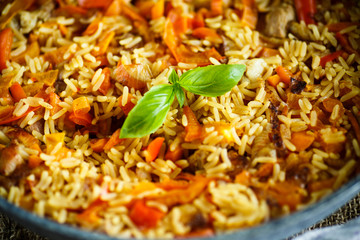 Pilaf with beef, carrots, onions, garlic, pepper and cumin.