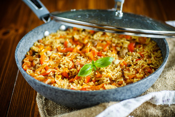 Pilaf with beef, carrots, onions, garlic, pepper and cumin.