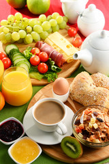 Breakfast served with coffee, orange juice, egg and fruits