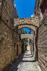Fototapeta na wymiar Charming narrow street at Rhodes old town, Rhodes island, Greece