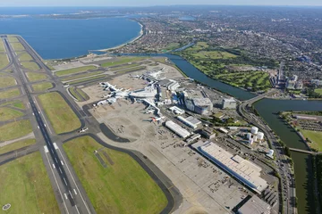Foto auf Acrylglas Antireflex Sydney Airport, International Terminal, looking south-west towards Brighton-Le-Sands © Aerometrex