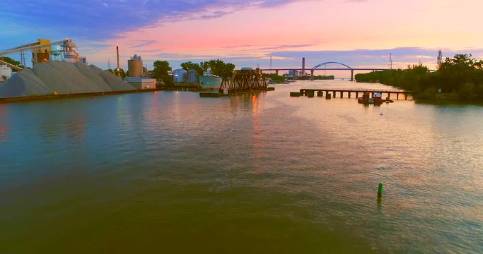 Stunning low aerial view at twilight, of Leo Frigo Memorial Bridge spanning Fox River.
