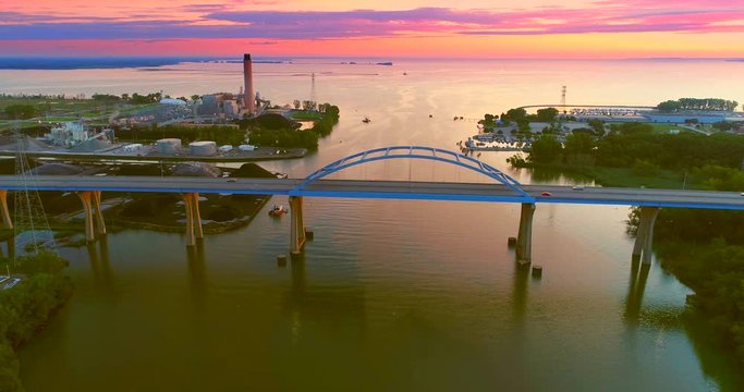 Stunning twilight aerial view of Leo Frigo Memorial Bridge spanning Fox River.
