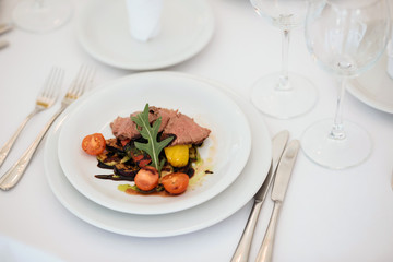 Banquet in restaurant. Table setting, fresh food.