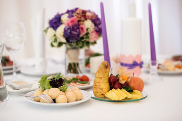 Sweets and fruits on banquet table