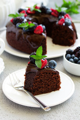 Fototapeta na wymiar Chocolate cake with glaze and fresh berries