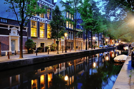 Canal of Amsterdam at night, Netherlands, Europe