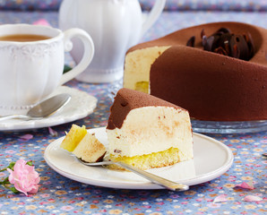 Elegant chocolate souffle cake covered with chocolate velor, with lemon confit.