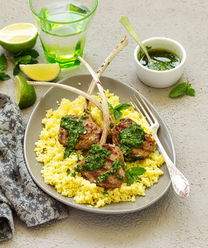 Lamb chops on bone, with mint-garlic sauce and couscous.