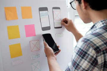 Web designer planning application for mobile phone