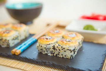 Hot fried Sushi Roll with salmon cheese. Sushi menu. Japanese food