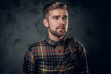 Bearded man over grey background.