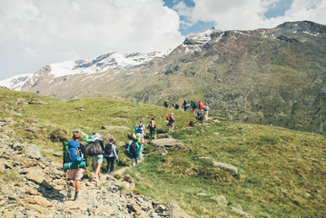 Fototapeta premium Zermatt, Switzerland - Matterhorn Mountain with white snow and blue sky in Zermatt city in Switzerland. People are hiking to the mountain