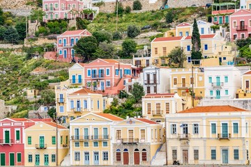 Fototapeta na wymiar Colorful, picturesque houses at Symi island, close to Rhodes island, Greece