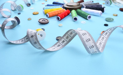 Background with sewing tools and accessories.