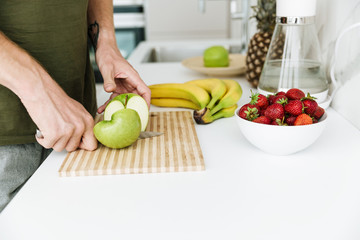 Cropped image of man cooking.