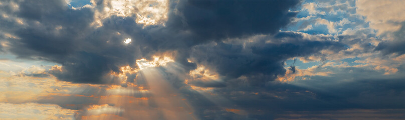 Naklejka na ściany i meble dramatic sunset with clouds and sun rays