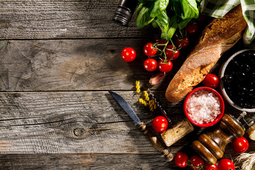 Tasty fresh appetizing italian food ingredients on old rustic wooden background. Ready to cook. Home Italian Healthy Food Cooking Concept.