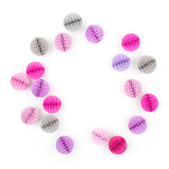 Creative arrangement frame of  pink and lilac  honeycomb balls with copy space for text. isolated on white background. Flat lay, top view.
