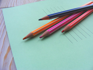 Colorful pencil colors and writing book for back to school