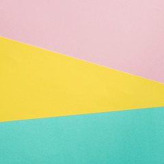 fashion geometric abstract texture of pink, yellow and blue papers