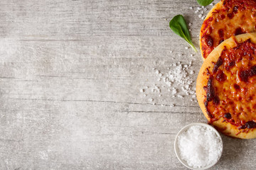 Obraz na płótnie Canvas Mini margarita pizza. Italian food. Simple background. Fast food