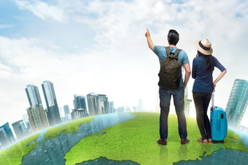 Happy asian couple tourist with suitcase and backpack