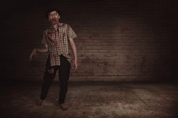 Fototapeta na wymiar Spooky asian zombie man with wounded face walking