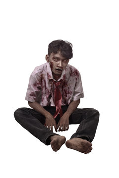 Spooky asian zombie man with blood sitting