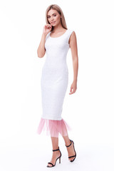 Fashion glamour sexy model beautiful woman pretty face long blond hair skin care perfect body shape white background makeup lady wear long dress style clothes for office party walk celebrity accessory