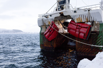 A Norwegian fishing boat parked in the port of Ålesund, Norway