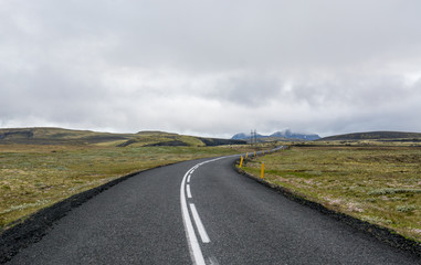 Long road crossing the famous Mossy lava field, Iceland