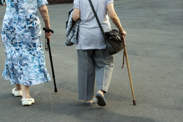 Elderly women with walking sticks on a walk