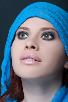 Model with blue scarf posing sensual