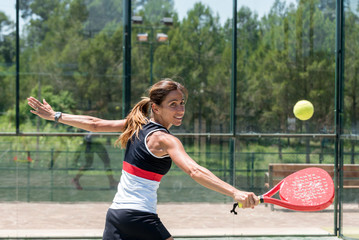 Woman playing padel outdoor