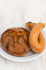 corn bread with smoked sausage farinheira on white plate