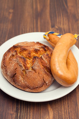 corn bread with smoked sausage farinheira on white plate