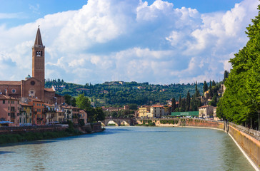 Fototapeta premium Northern Italy, Verona, the Adige River. View of the city from the bridge on a sunny day.