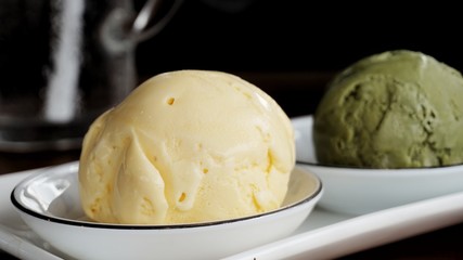Vanilla and Green tea Matcha ice cream on white plate