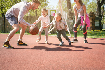 Family playing basketball.