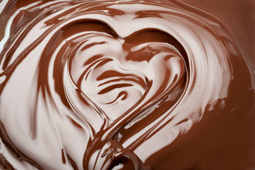 Melted chocolate heart.  Swirl chocolate splash background.